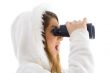 astonished female watching through binocular