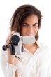 smiling woman holding video camera