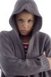 female with hood coat looking at camera