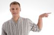 smiling man pointing to the side