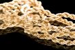 Golden chain on black macro