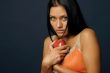 Beautiful exotic woman with apple