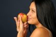 Beautiful exotic woman with apple