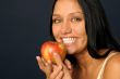 Beautiful exotic woman with apple