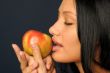 Beautiful exotic woman with apple