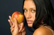 Beautiful exotic woman with apple