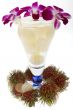 Rambutan with fruit juice and orchid