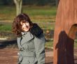 Joyful young woman in the autumn garden