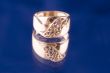 Golden ring close up on blue