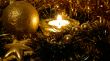 Golden xmas ball in candle light