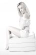 Woman sitting on a wooden case