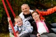 Happy family on the swing