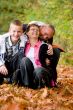Happy family is having fun in the autumn