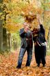 Older couple tossing leafs