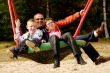 Happy family swinging