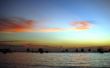 Drifting boat on a sunset