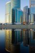 Skyscrapers at sunset and reflection