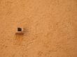 small drain in a orange wall
