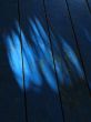 light and shadow on a blue floor