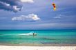 kitesurfer and white sandy beach