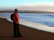 Man enjoying sunset by the ocean