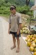 Hmong man in Laos with grape container