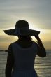 Beach female hat sunset silhouette
