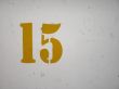 yellow number on a wall