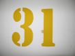 yellow number on a wall