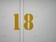 yellow number on a wall