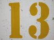 yellow number on a wall