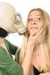 two girls - one in gas mask
