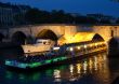 Boats on the night Seine in Paris