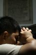 Young man praying closeup