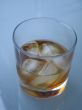 drink with ice on a glass table