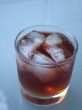 drink with ice on a glass table
