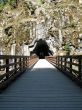 long, old wooden bridge going into a tunnel