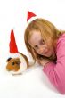 cute little red hair girl together with her guinea pig wearing a
