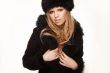 Woman in black fur hat and coat