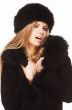 Woman in black fur hat and coat