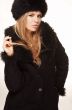 Woman in black fur hat and coat