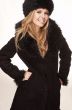 Woman in black fur hat and coat