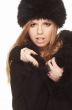 Woman in black fur hat and coat