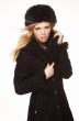 Woman in black fur hat and coat