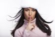 beautiful brunette with hatl posing on white background
