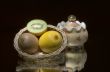 Lemon,kiwi,basket and sugar bowl.