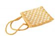 Beautiful gold bag with mirrors on white
