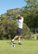 Golfer hitting the ball off the tee box