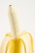 One cleared banana on light background