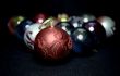 Red glass sphere on Christmas decoration background